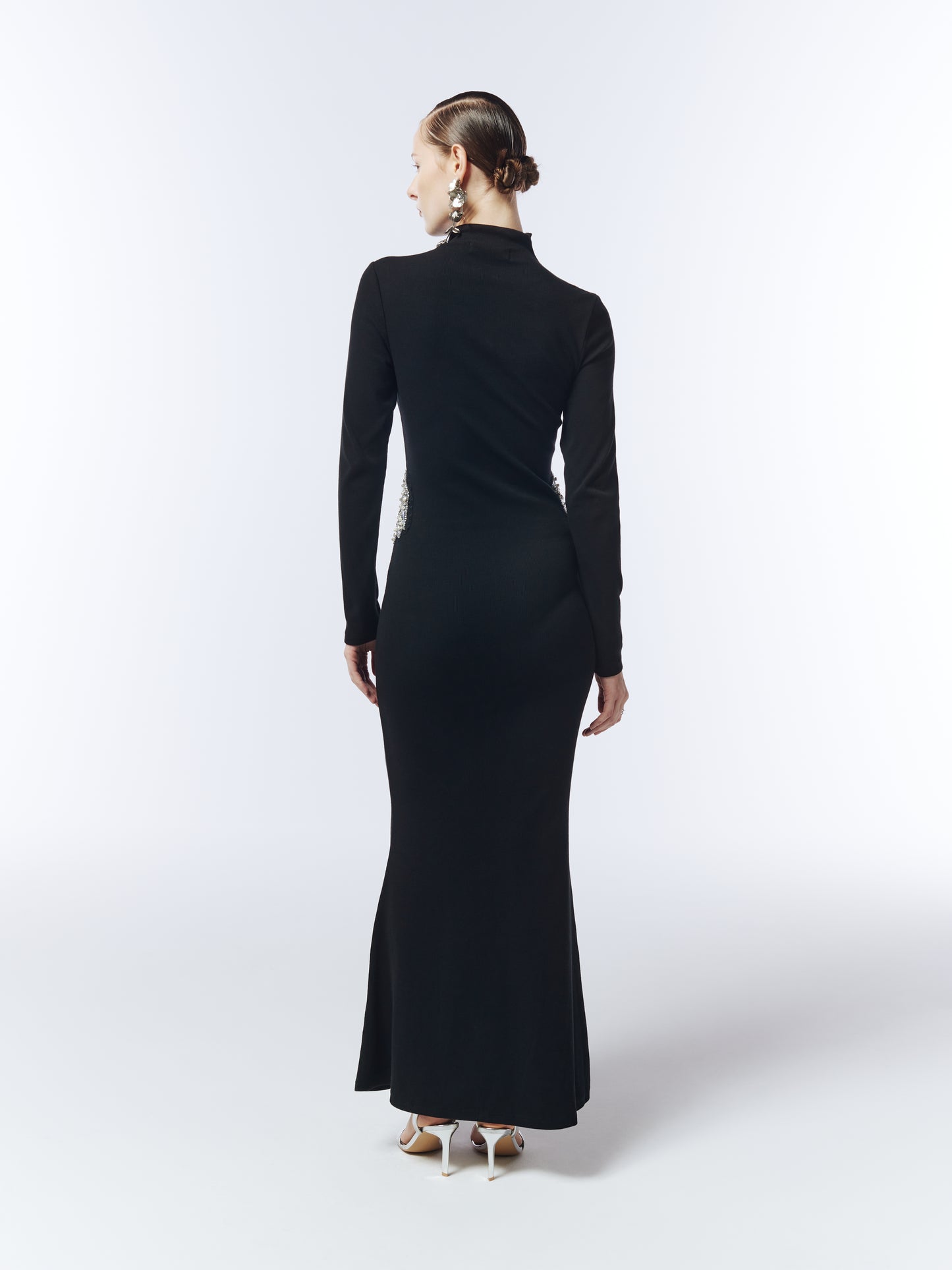 Elegant black floor-length dress with high neckline and crystal embellishments designed by SOUR FIGS.