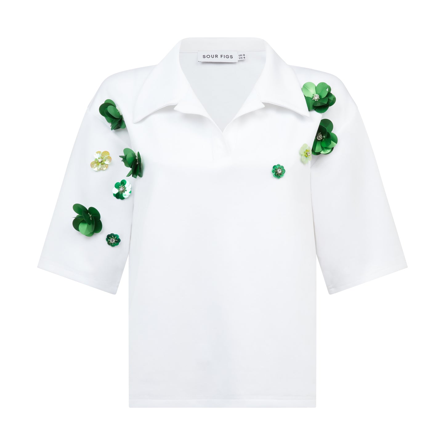 Close-up of floral beadwork on structured cotton poplin polo shirt