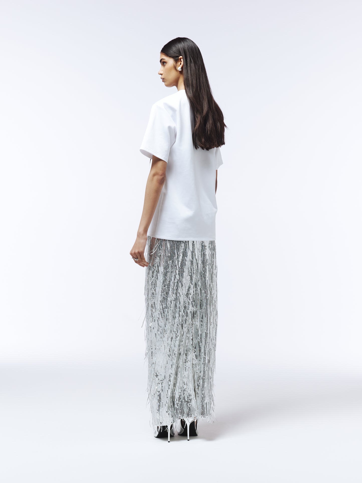 Lace-appliquéd white T-shirt styled with tailored trousers