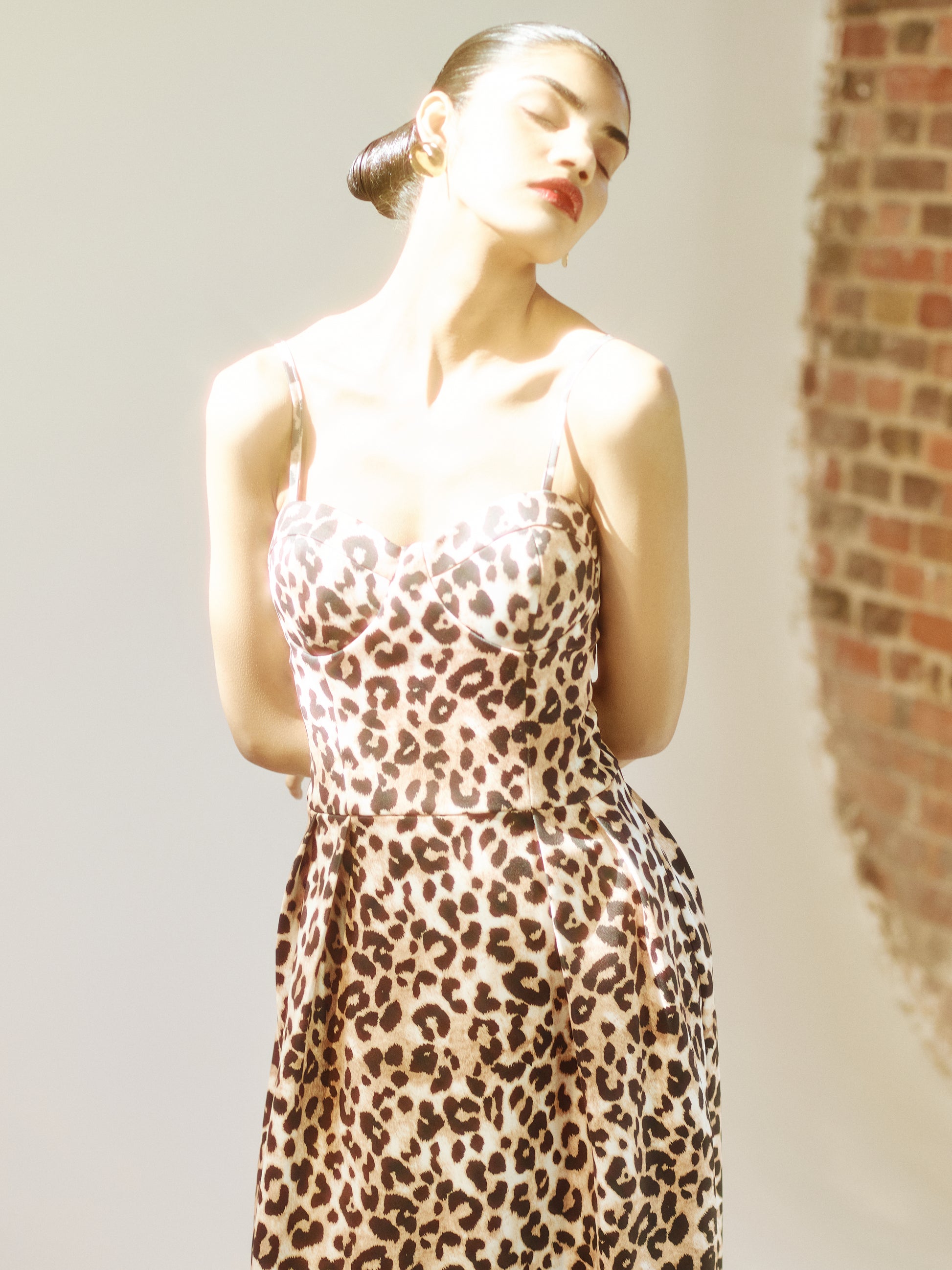Model wearing SOUR FIGS Leopard Print Midi Dress in Champagne Caramel under soft studio light.