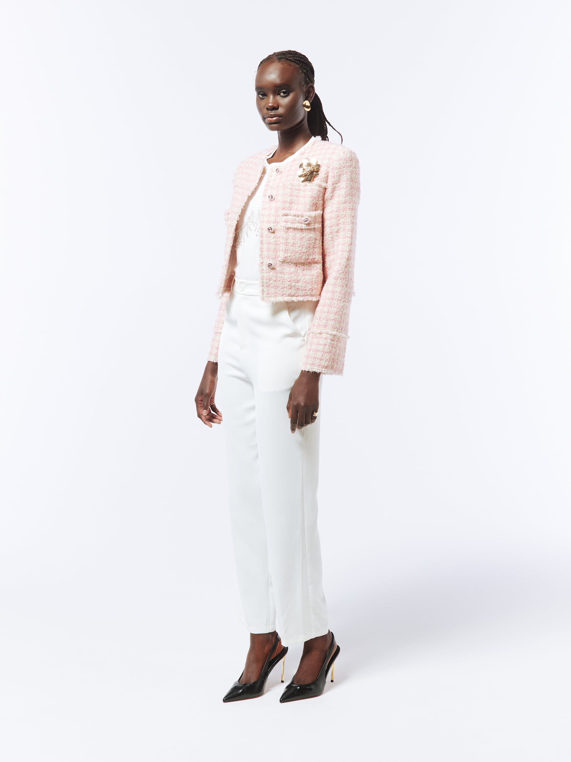 Close-up of the SOUR FIGS Dawn Pink Checked Bouclé Tweed Jacket, featuring luxe gold-tone brooch detailing and a tailored silhouette.