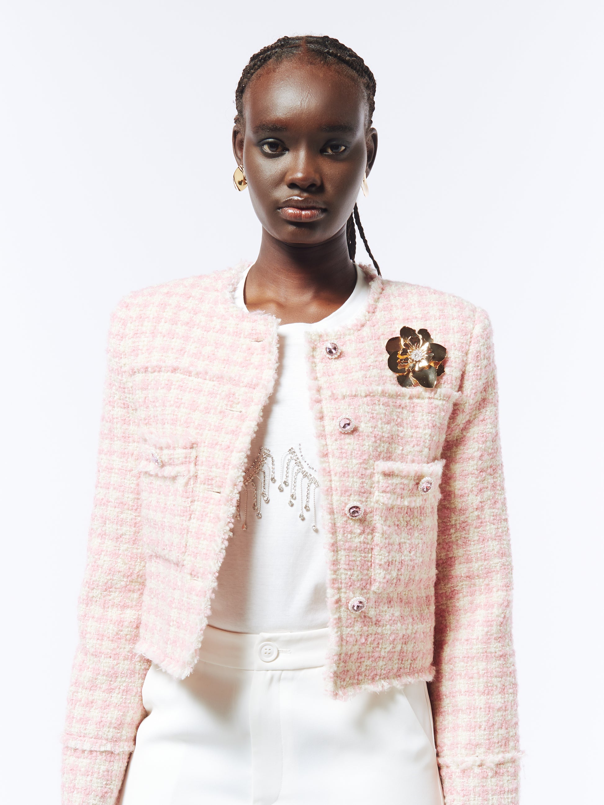 Women’s pastel pink tweed jacket by SOUR FIGS – designed with intricate brooch embellishments and a flattering structured fit.
