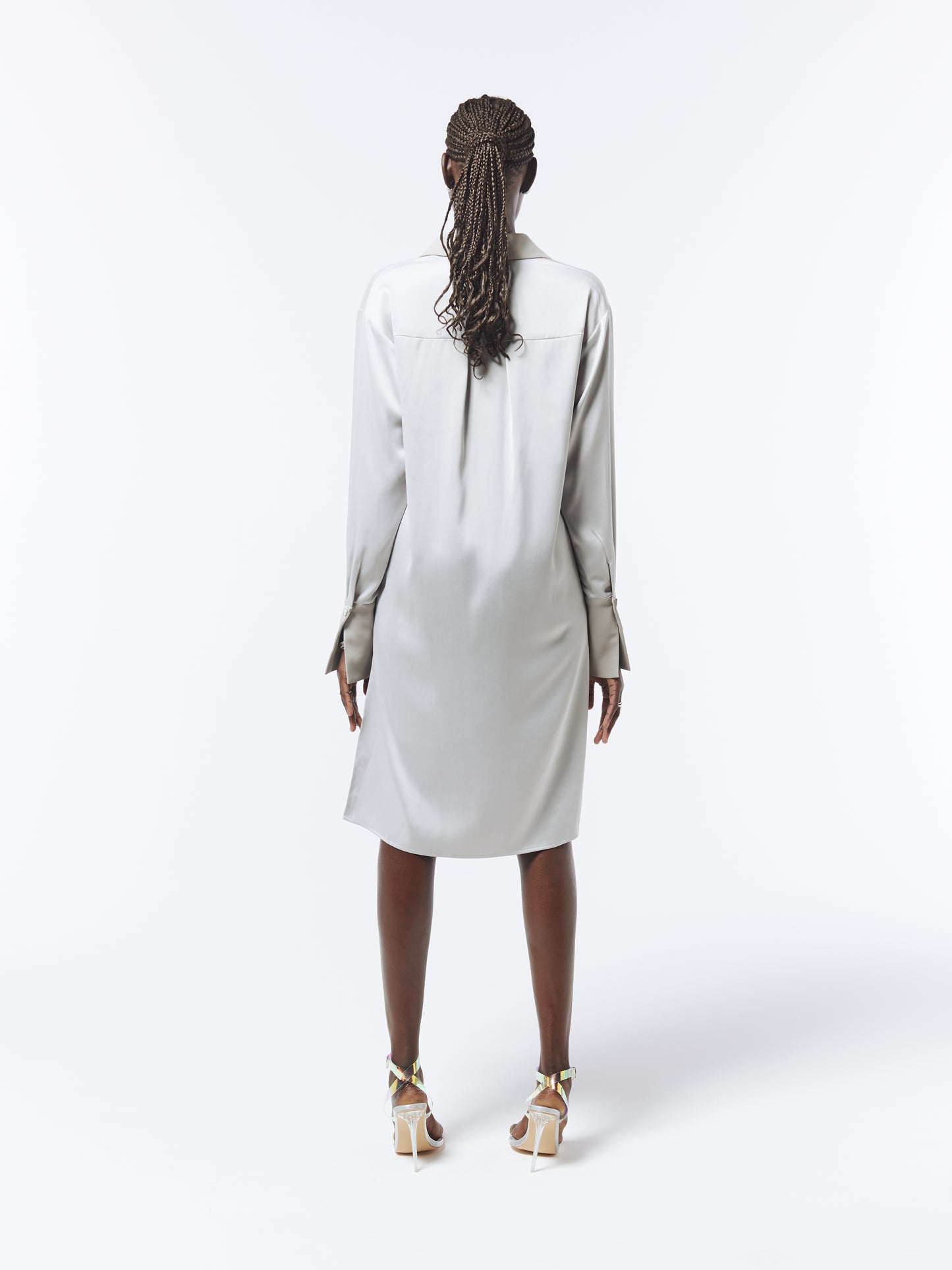 Silver satin shirt dress with asymmetric hem by SOUR FIGS – a contemporary take on timeless elegance.