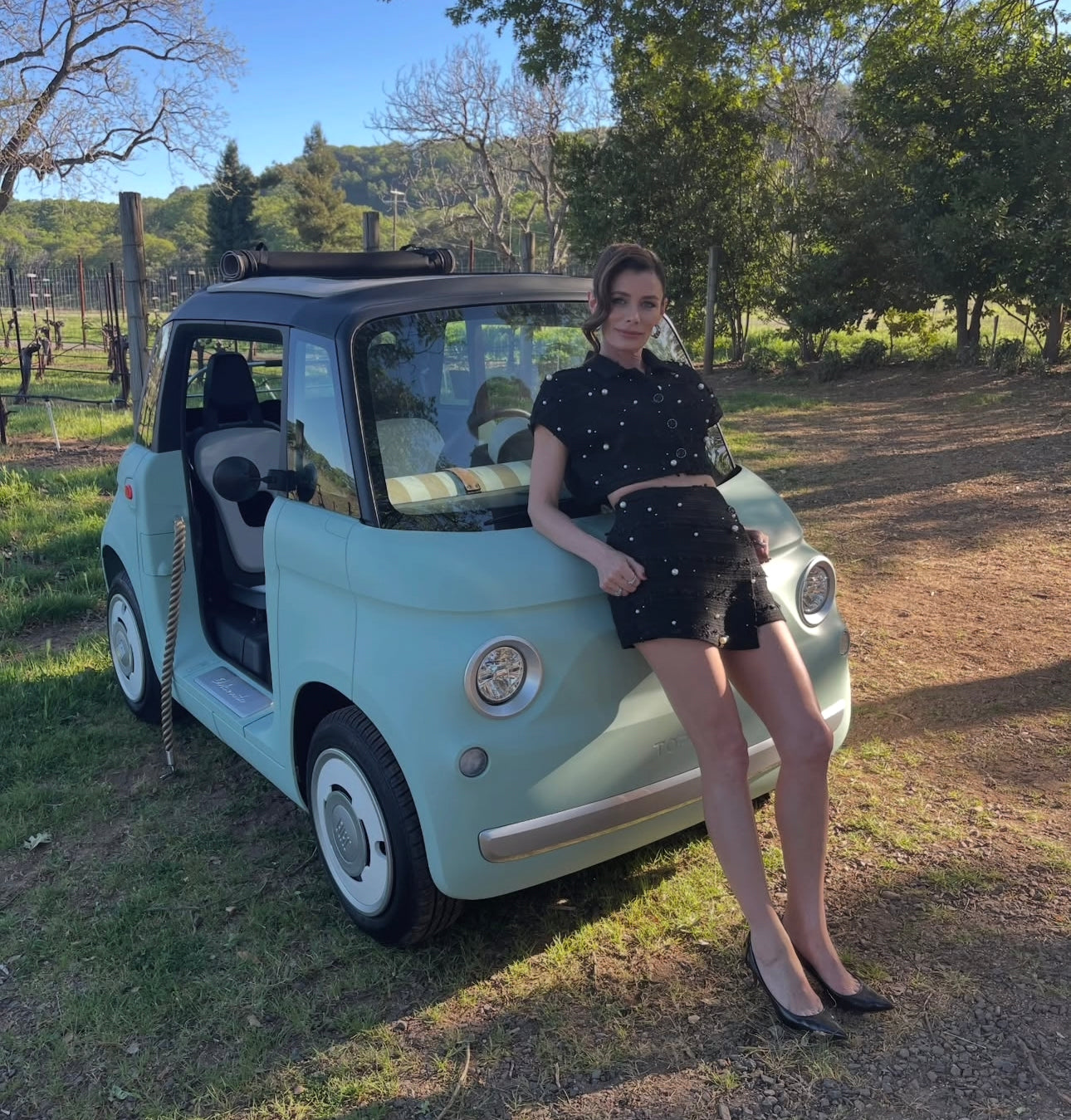 Kat Coiro wears Sour Figs Faux Pearl-Embellished Cropped Vest and matching skort while celebrating her latest film You, Me & Tuscany 