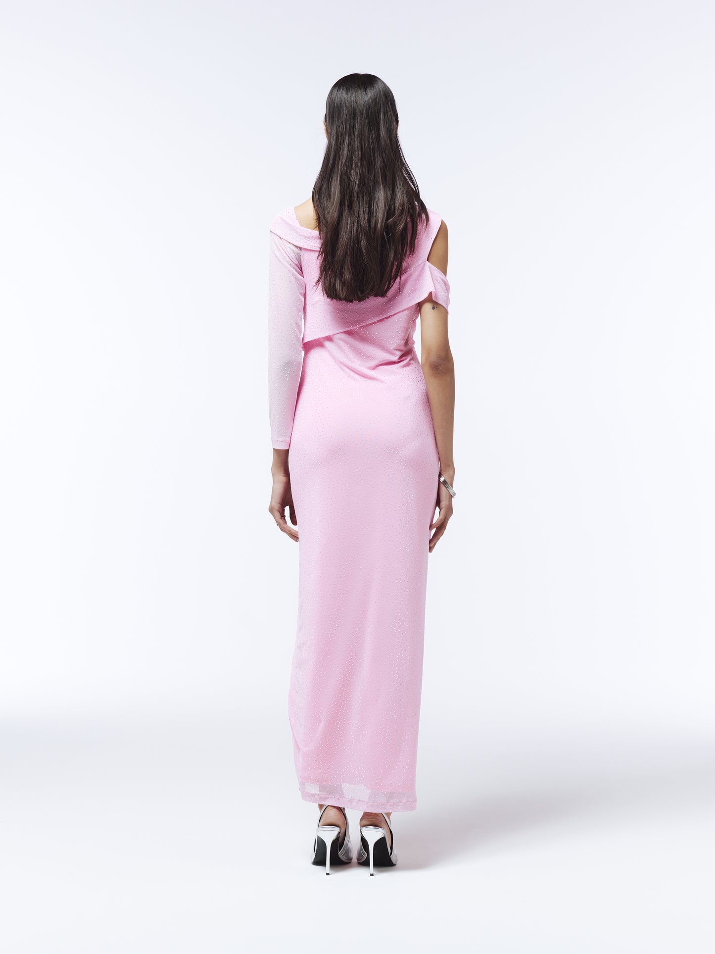Elegant pink formal dress with asymmetrical neckline, rhinestone accents, and front slit from SOUR FIGS