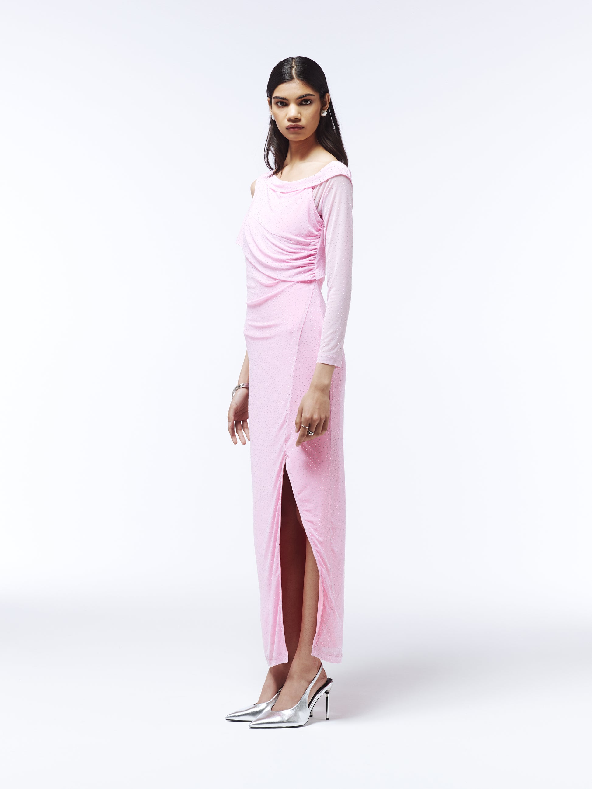 SOUR FIGS shimmering pink gown with single sleeve, rhinestone-covered stretch fabric, and high side slit.
