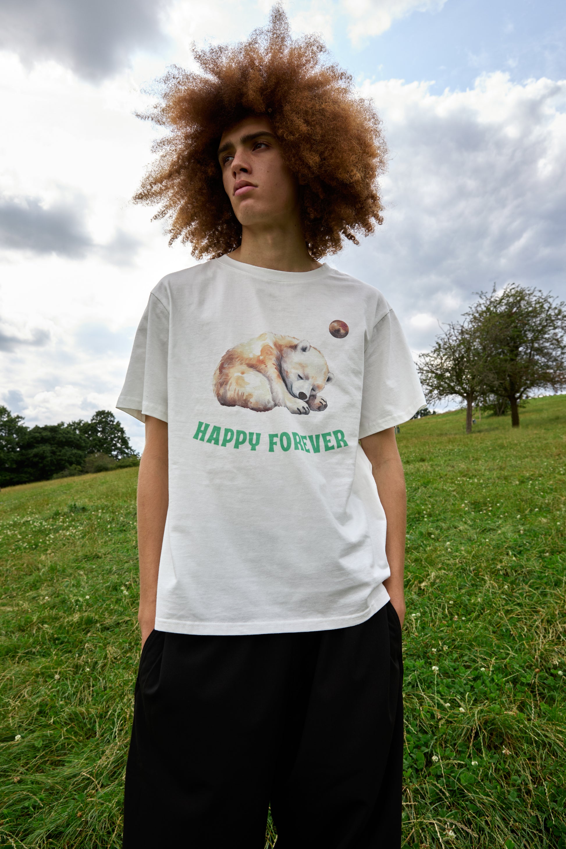 SOUR FIGS short-sleeve T-shirt featuring dreamy sleeping bear illustration and mint green lettering.