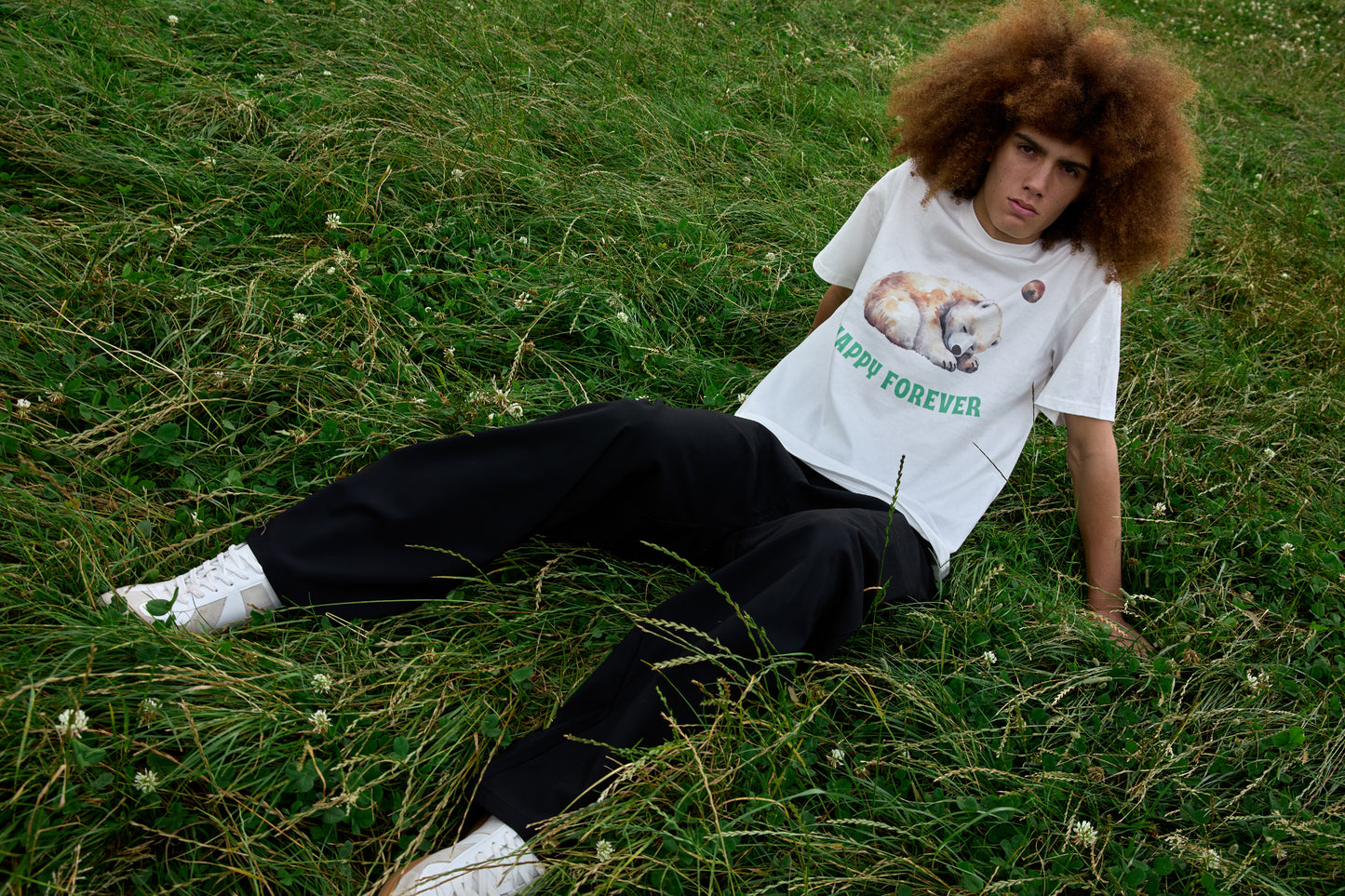White slogan T-shirt with animal print and celestial motif from SOUR FIGS.
