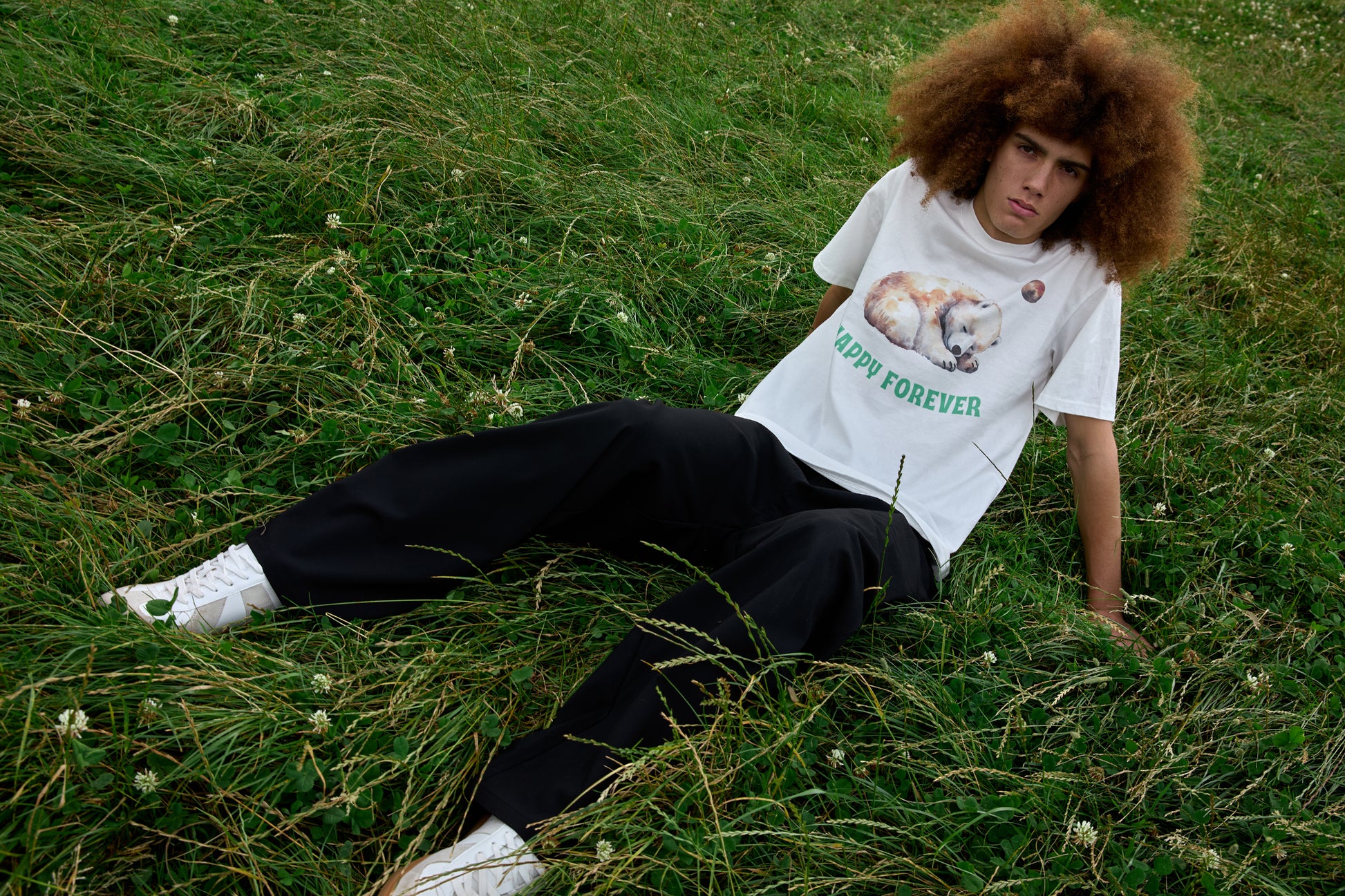White slogan T-shirt with animal print and celestial motif from SOUR FIGS.