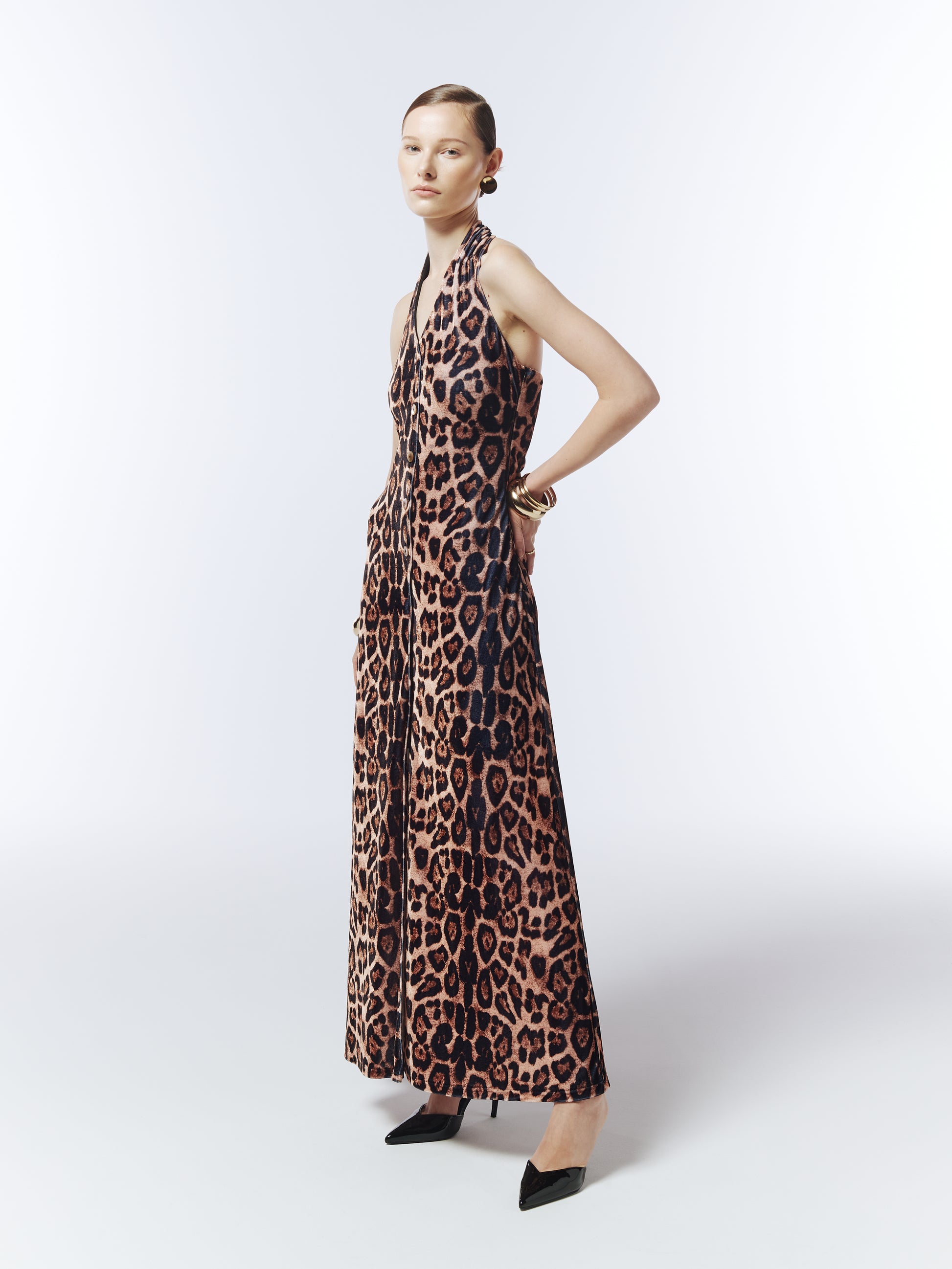 Model wearing SOUR FIGS leopard print velvet halterneck maxi dress with open back