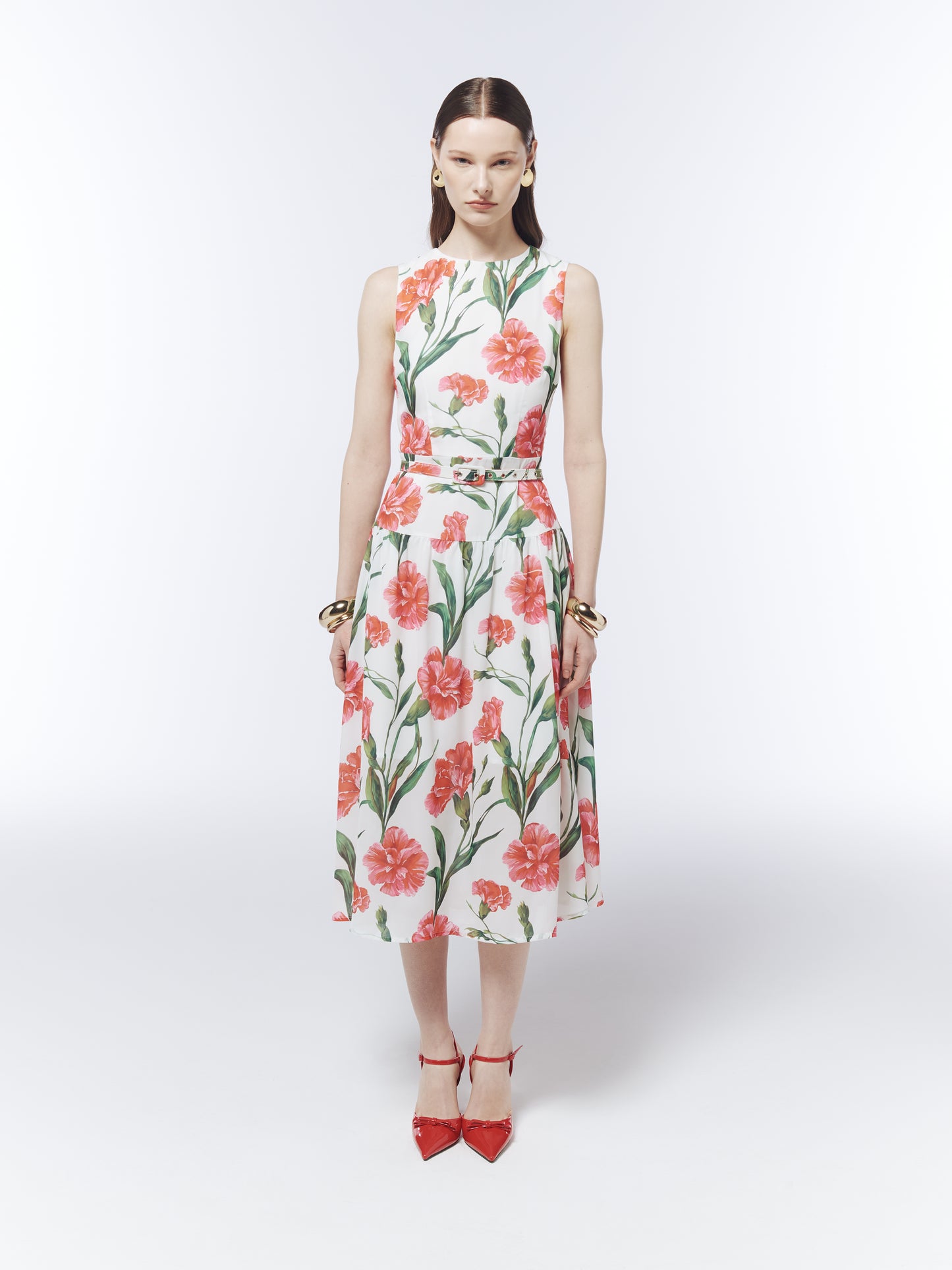 Front view of the SOUR FIGS sleeveless floral midi dress with round neckline and coordinating buckle belt.