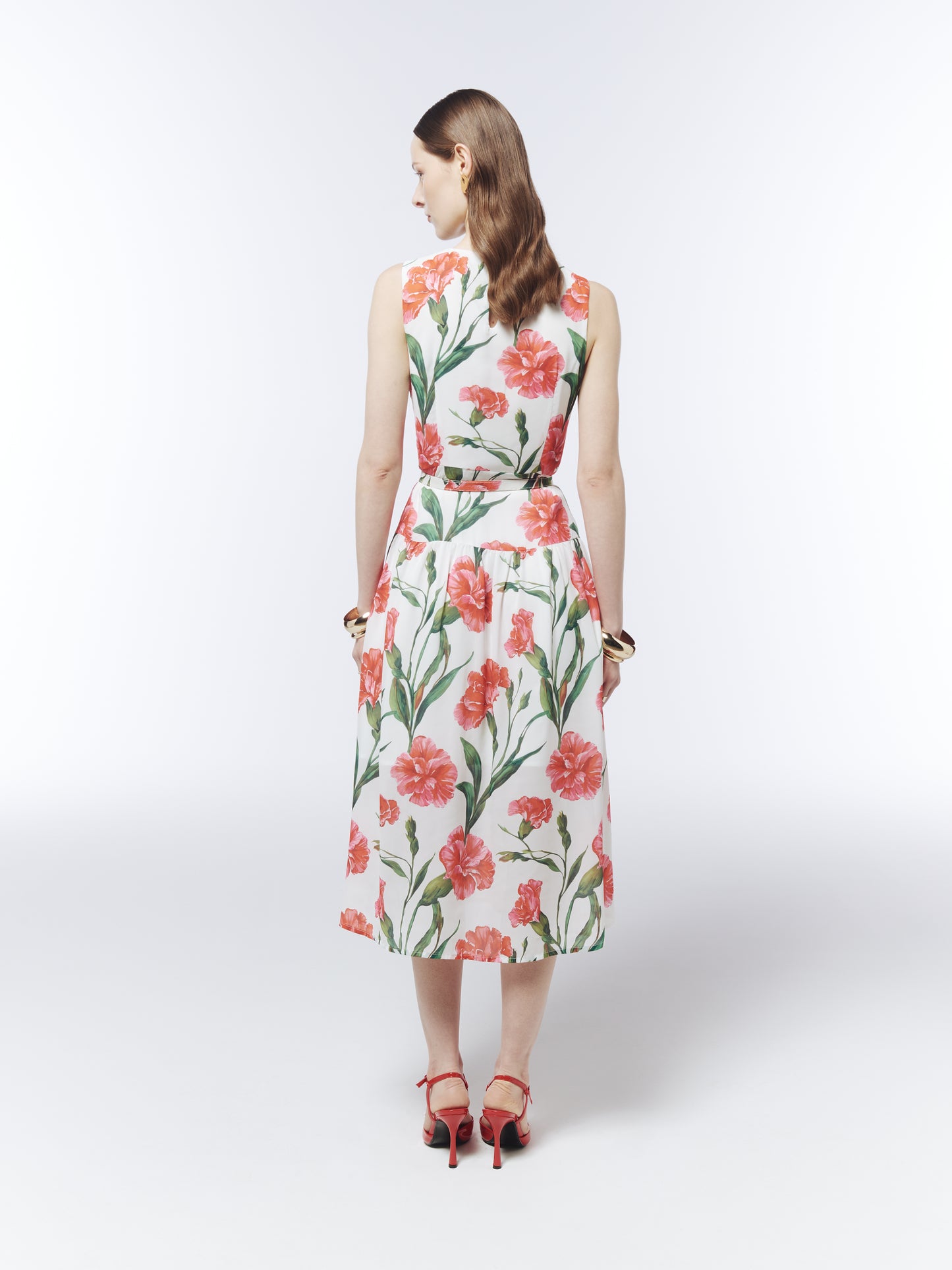 Back view of the SOUR FIGS belted floral midi dress with a softly gathered skirt and botanical pattern.
