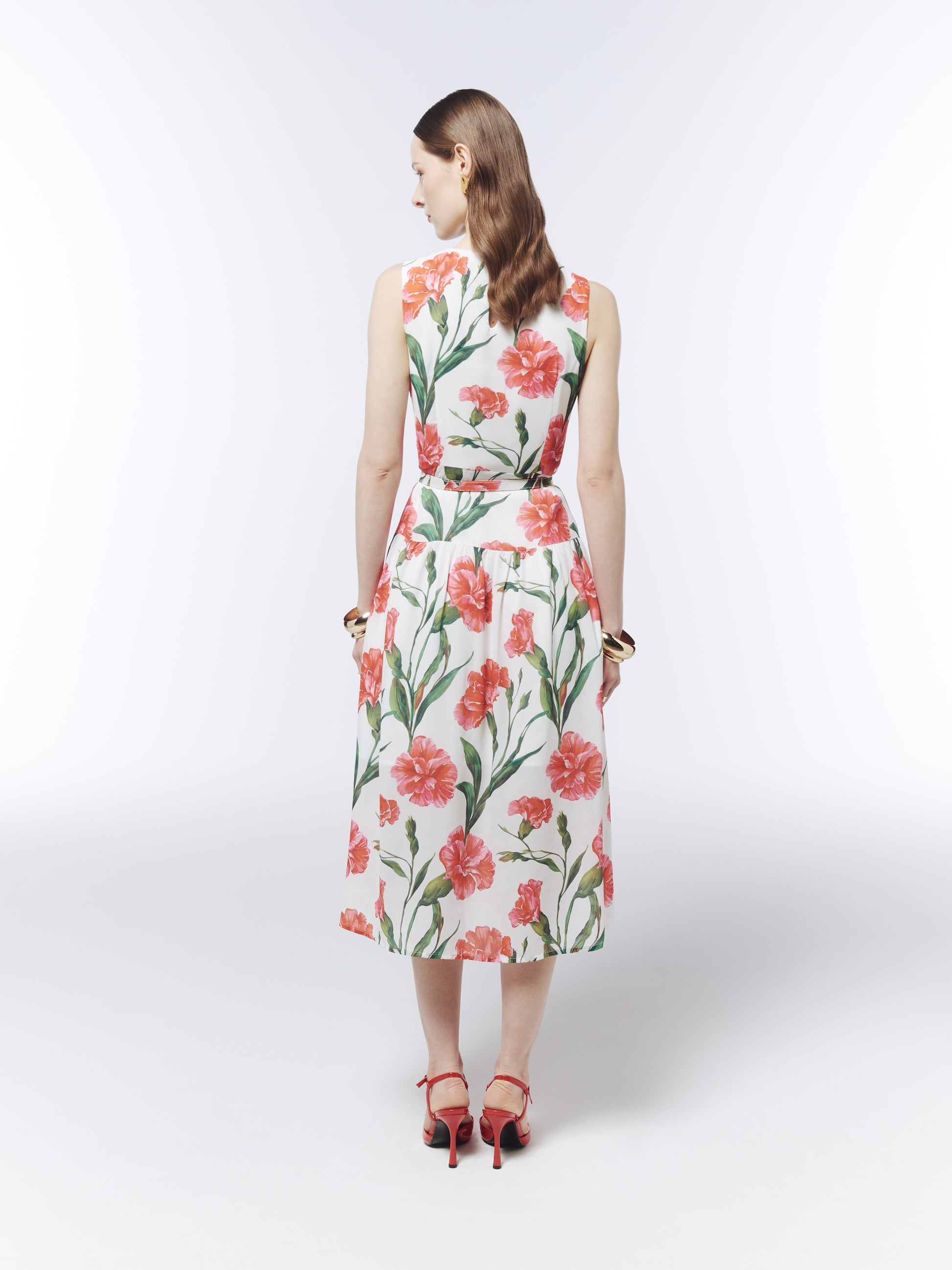 Back view of the SOUR FIGS belted floral midi dress with a softly gathered skirt and botanical pattern.