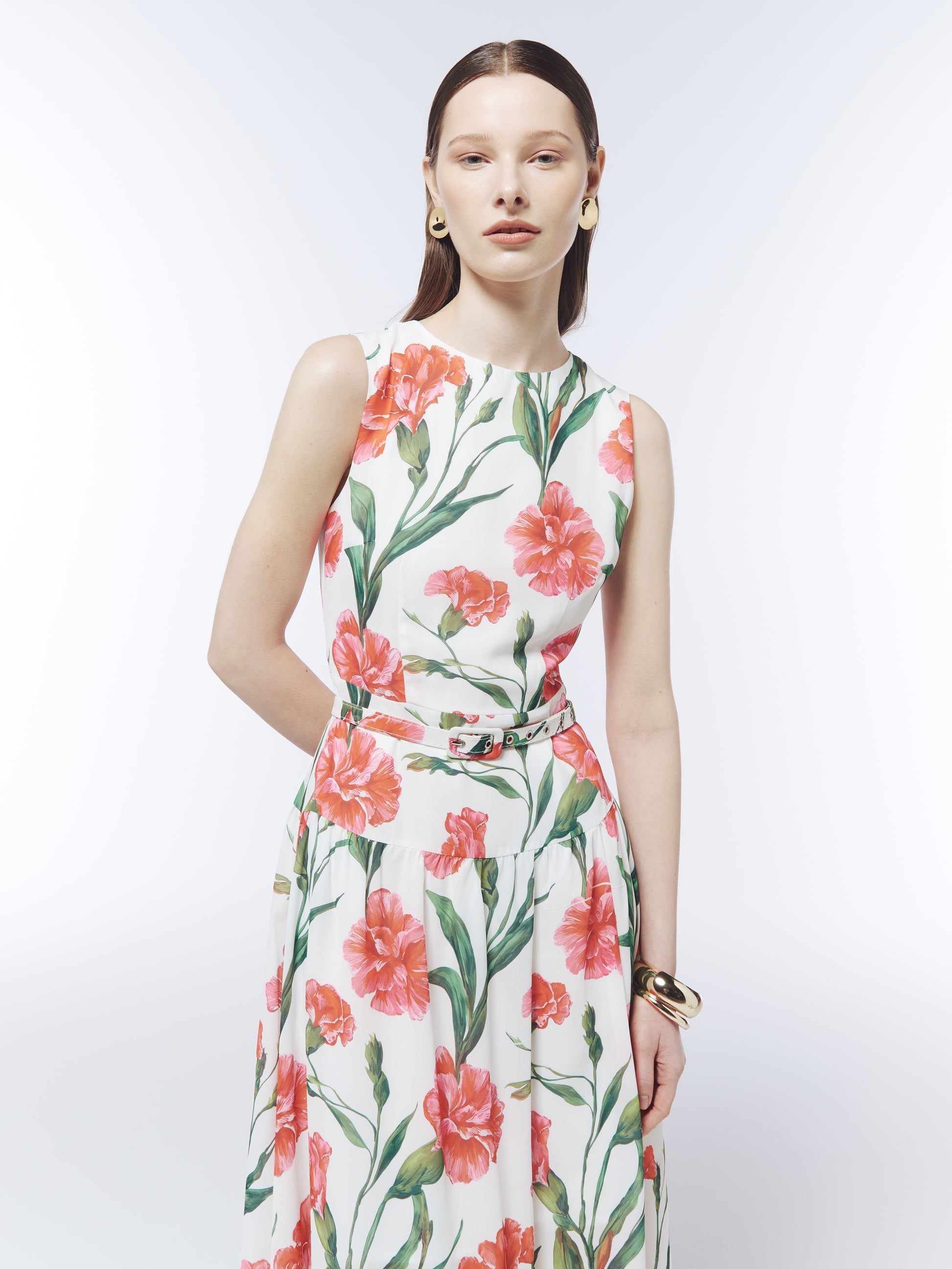 Close-up of the SOUR FIGS coral carnation print, round neckline and adjustable fabric-covered belt.