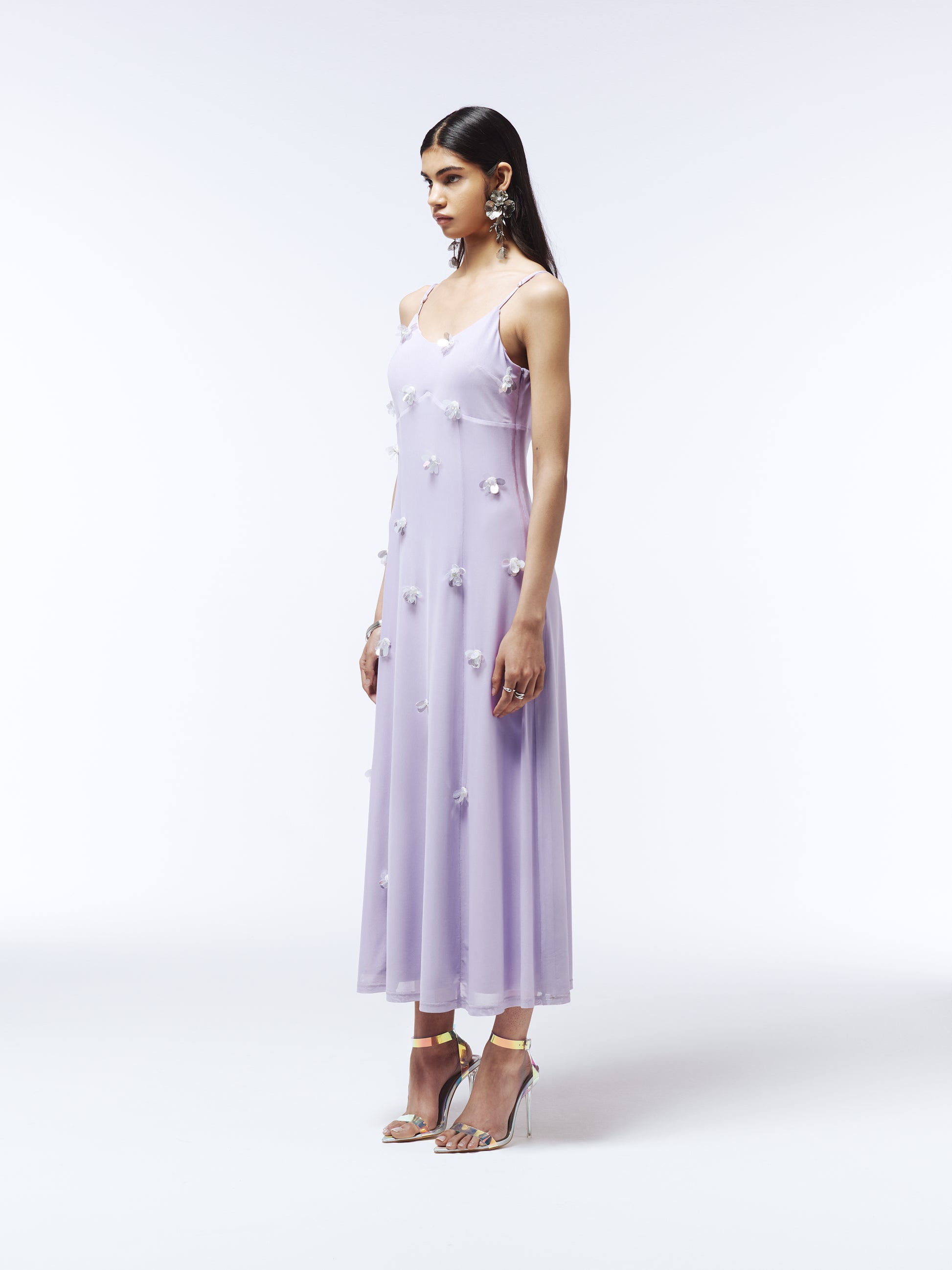 Model wearing lilac embellished sheer tulle dress with floral sequin details