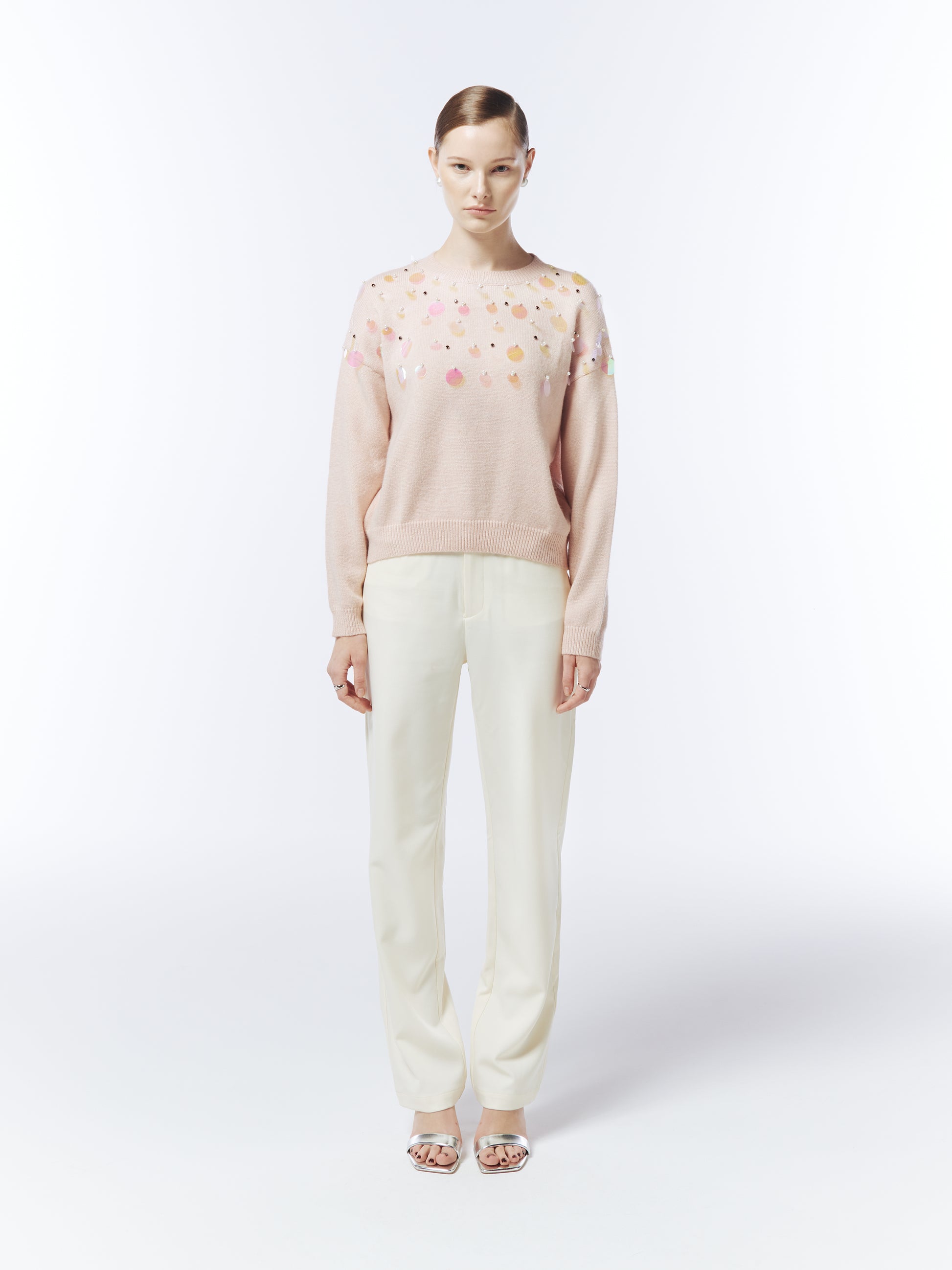 Model wearing SOUR FIGS Iridescent Sequin-Embellished Jumper in Tropical Peach Pink