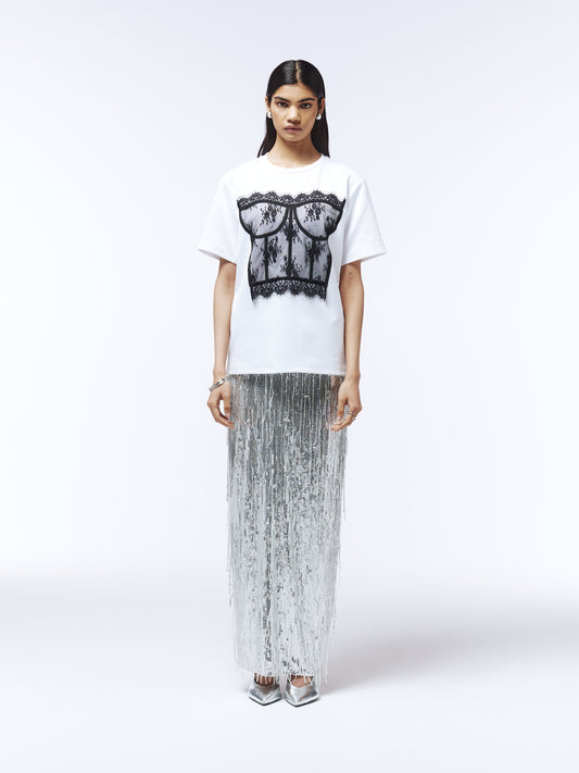 Model wearing short-sleeve T-shirt with sheer lace corset detailing