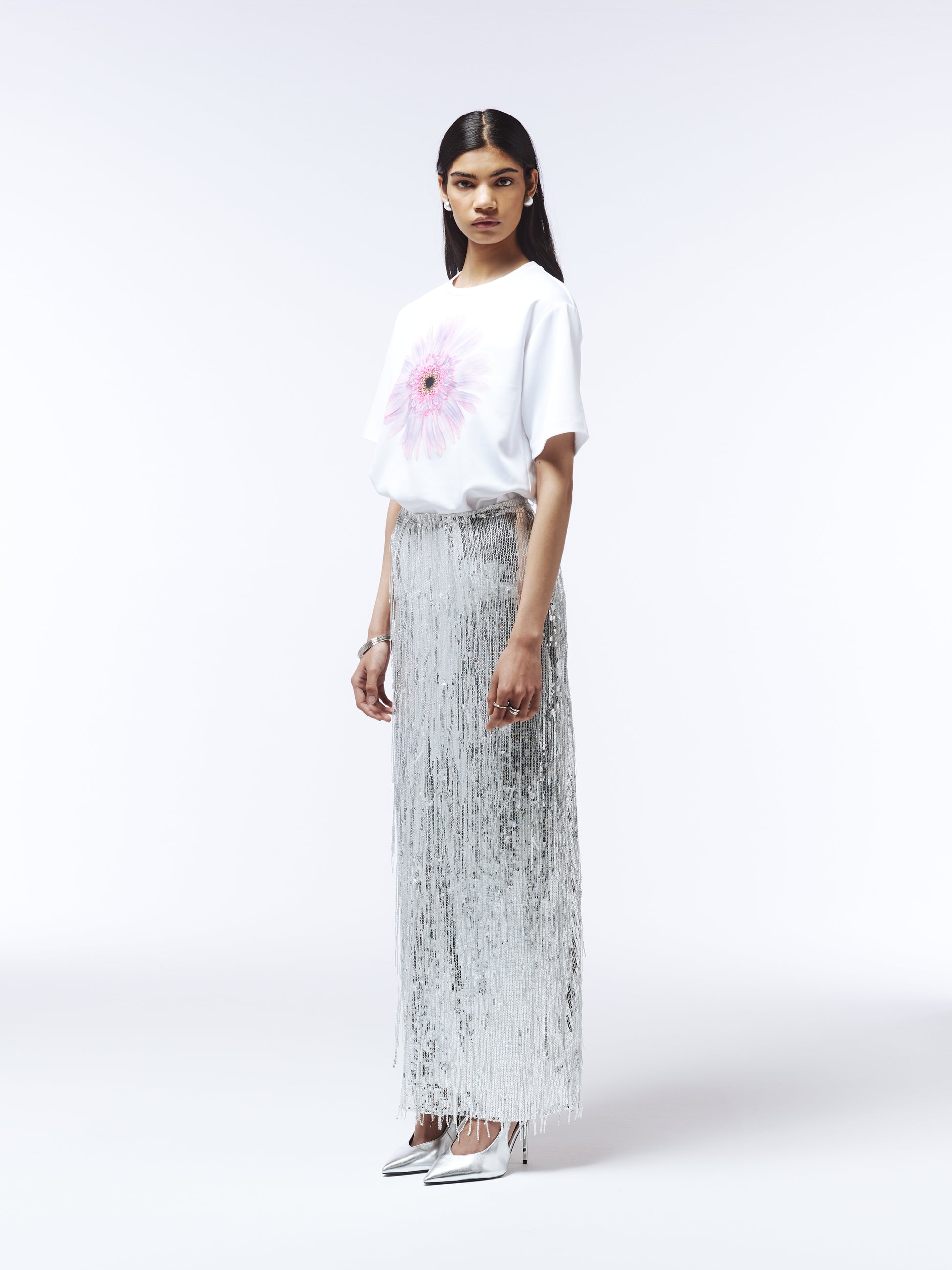 Close-up of gerbera illustration on crisp white SOUR FIGS T-shirt