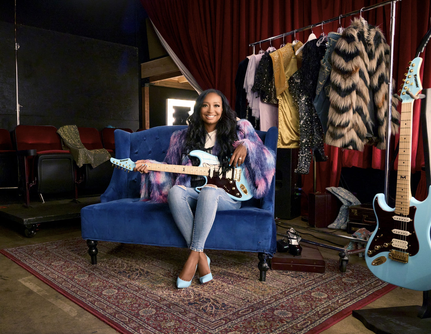  Malina moye wearing the lace corset-appliqué t-shirt in white for a shoot with gibson guitars