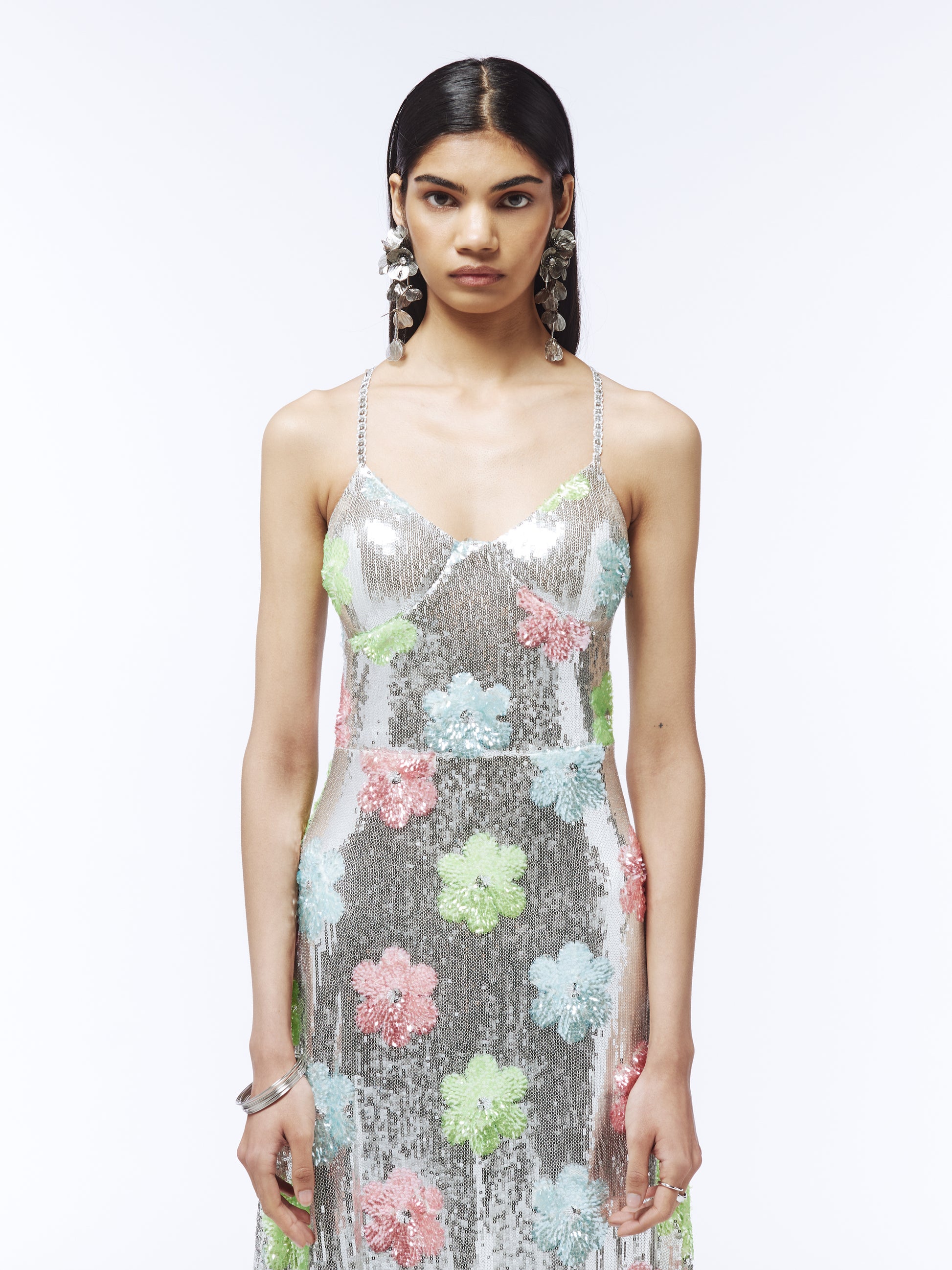 Sparkling metallic silver midi dress adorned with pastel-colored sequined flowers from SOUR FIGS.