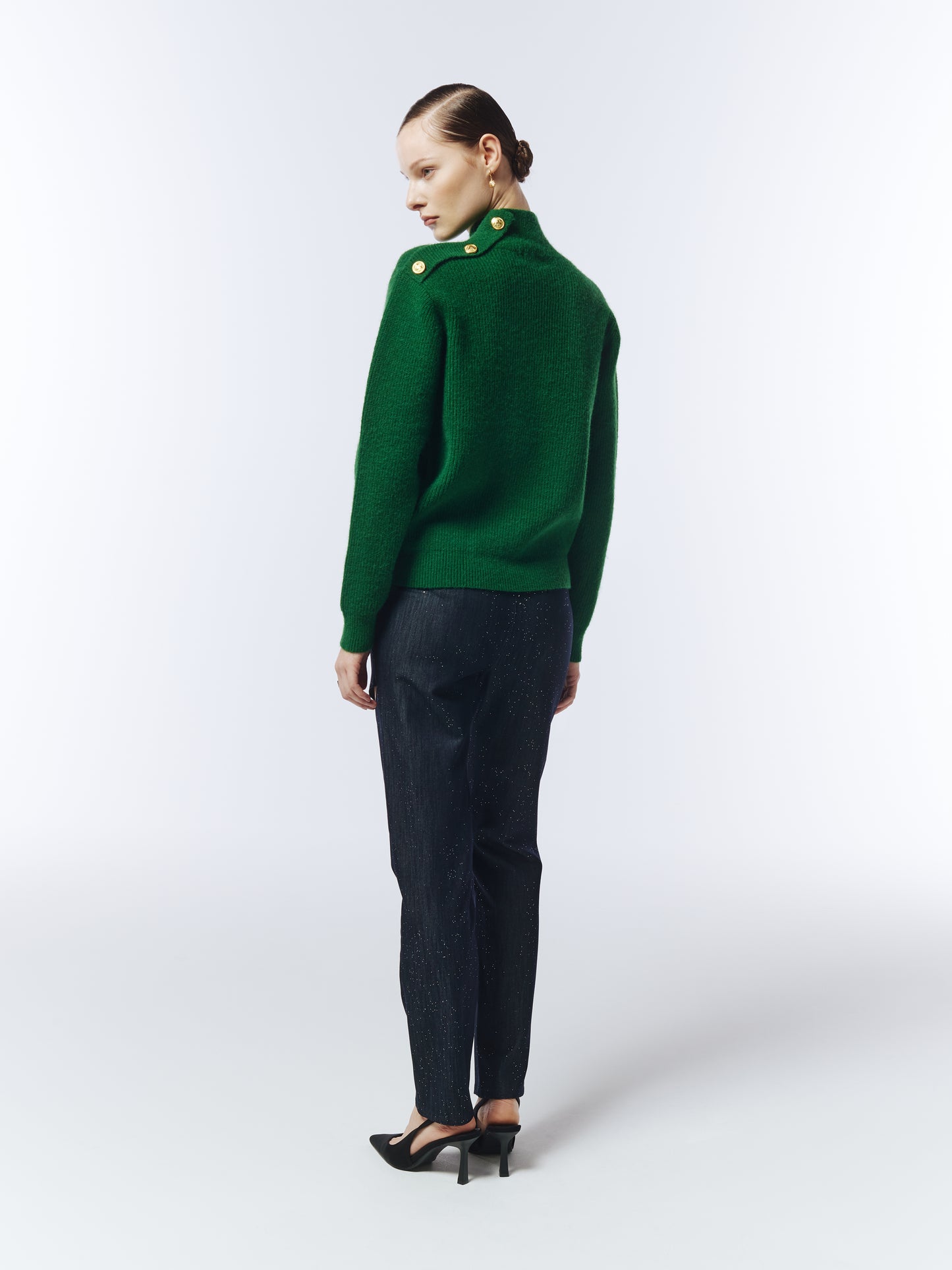 Back view of pine green jumper with relaxed fit and ribbed hem.