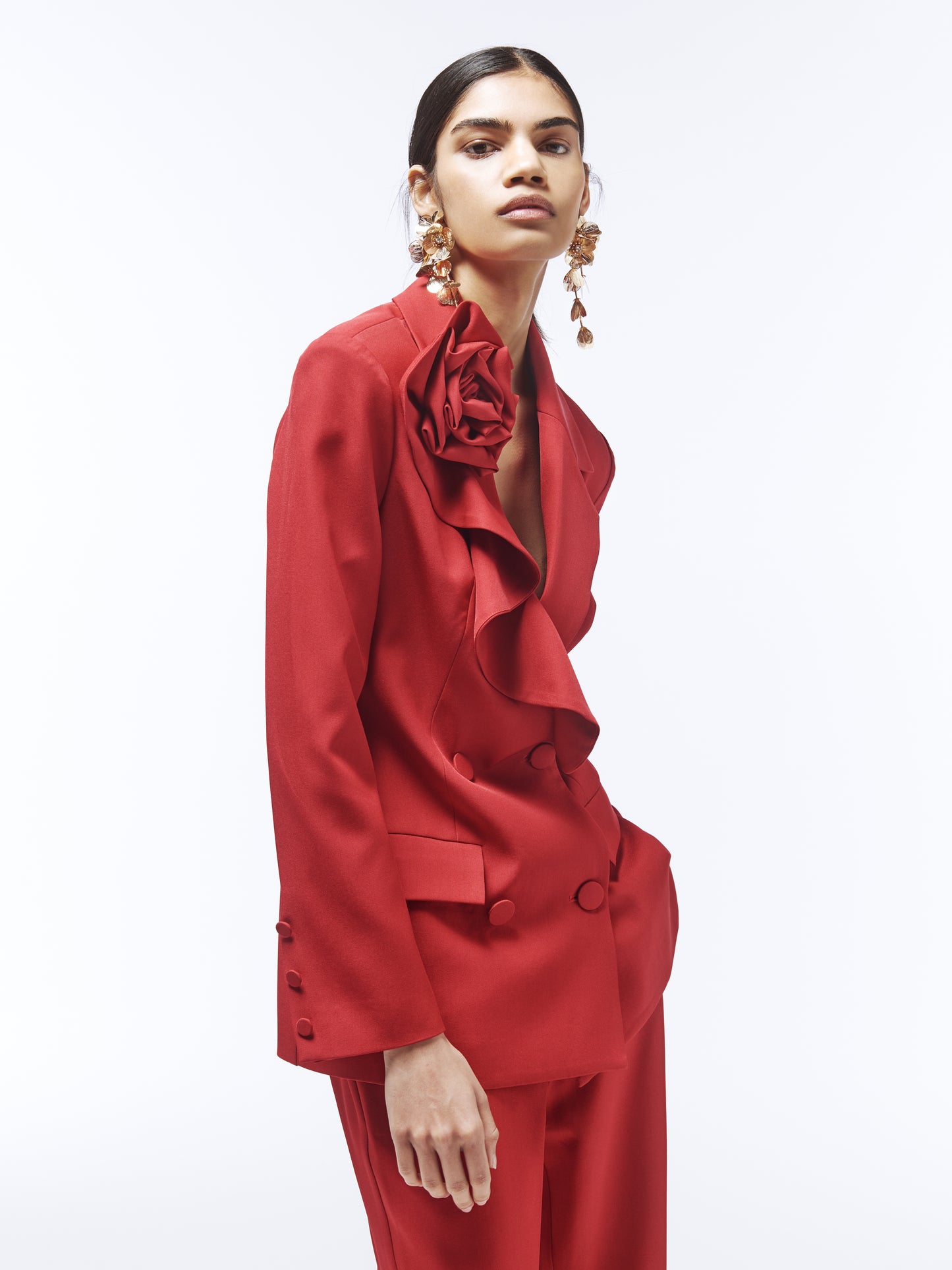 Close-up of ruffle lapel and 3D rose appliqué on SOUR FIGS vivid burgundy red blazer.