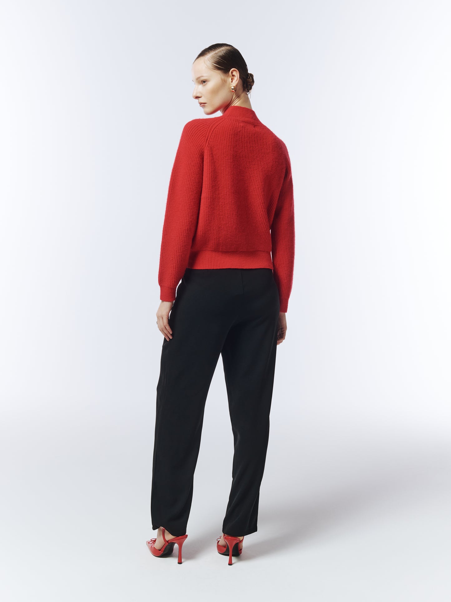 Back view of red jumper with relaxed silhouette designed by SOUR FIGS
