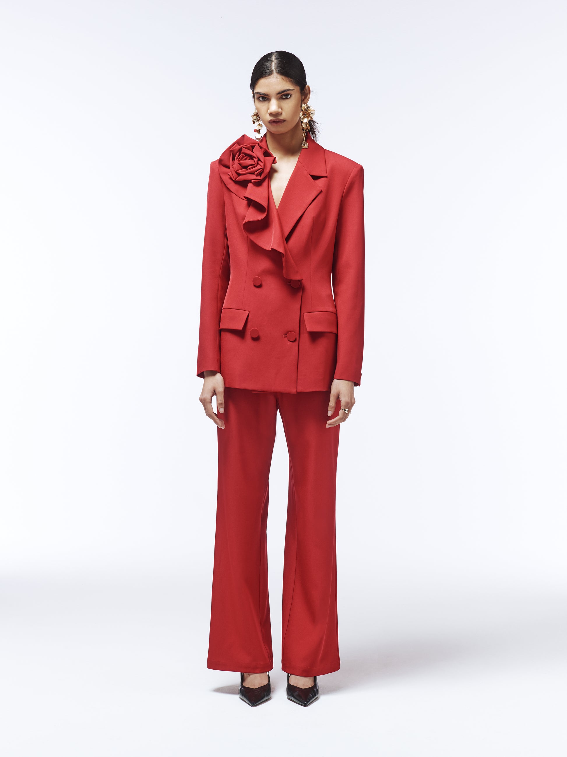 Full look with SOUR FIGS Rose-Detail Double-Breasted Blazer and matching trousers in vivid burgundy red.