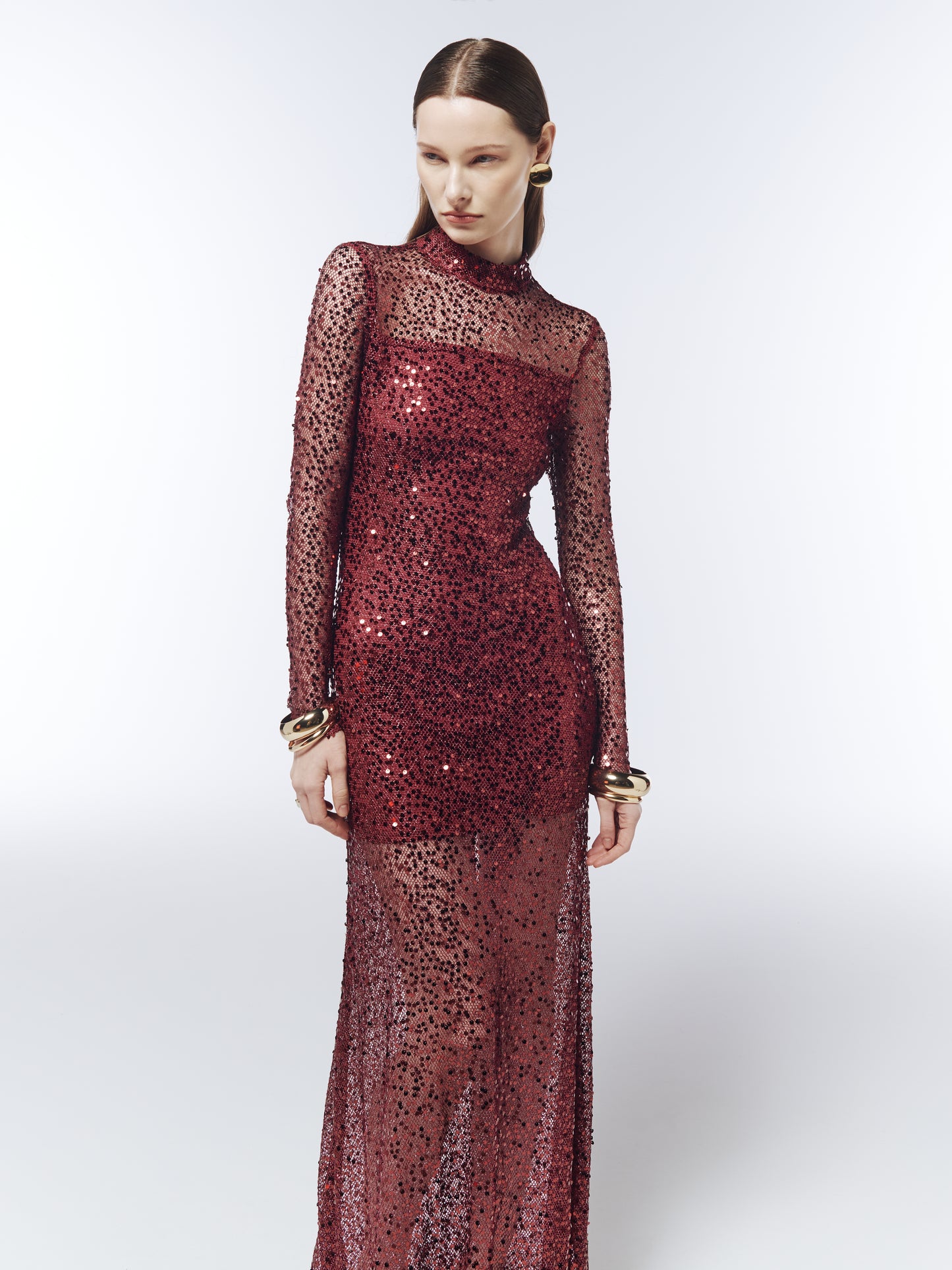 SOUR FIGS fitted floor-length sequin gown with high neckline, sheer sleeves and transparent lower skirt