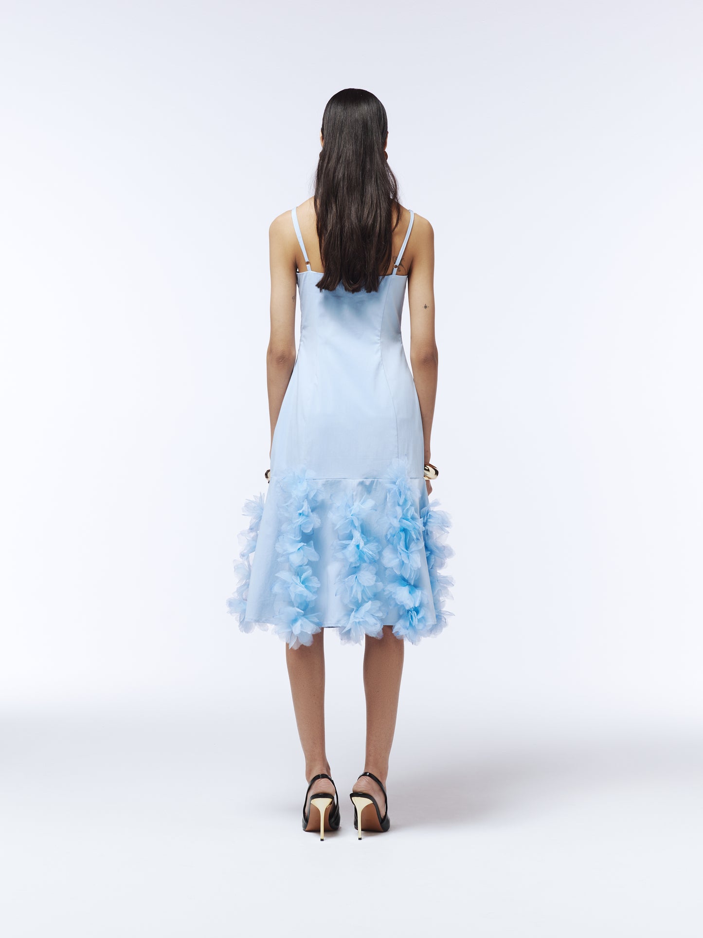 Whimsical blue occasion dress with watercolour-finished floral appliqué along hem, designed by SOUR FIGS.