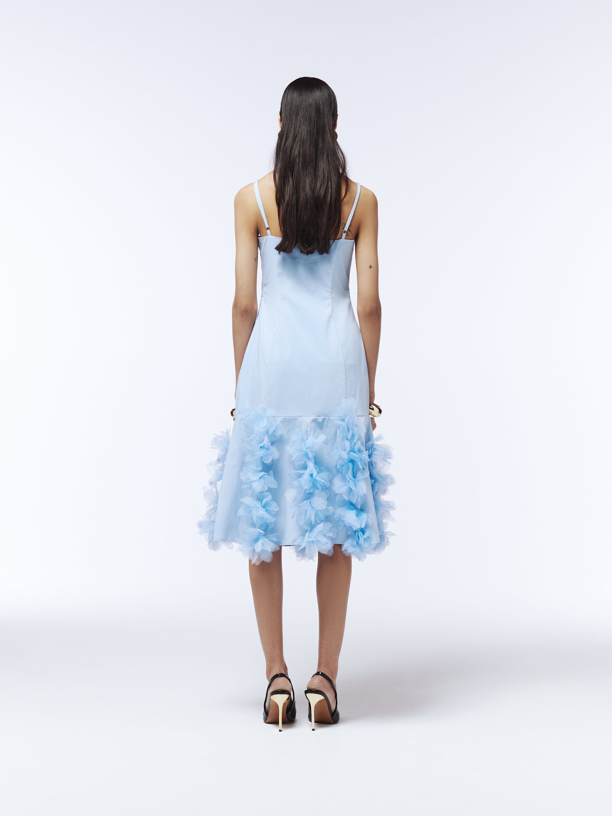Whimsical blue occasion dress with watercolour-finished floral appliqué along hem, designed by SOUR FIGS.