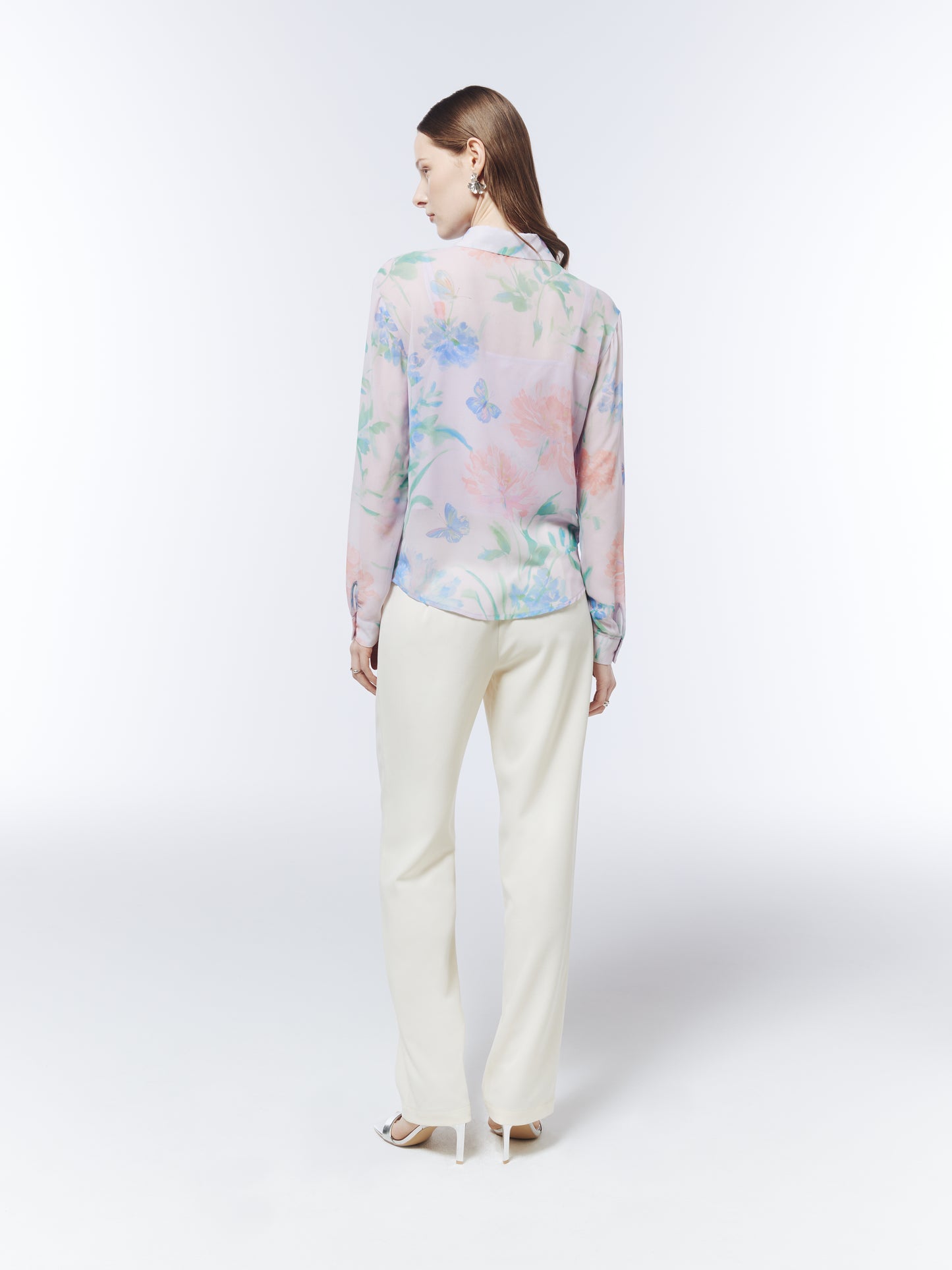 SOUR FIGS Petal Mist Lilac blouse styled with cream trousers, featuring a soft botanical print and semi-sheer outer layer.