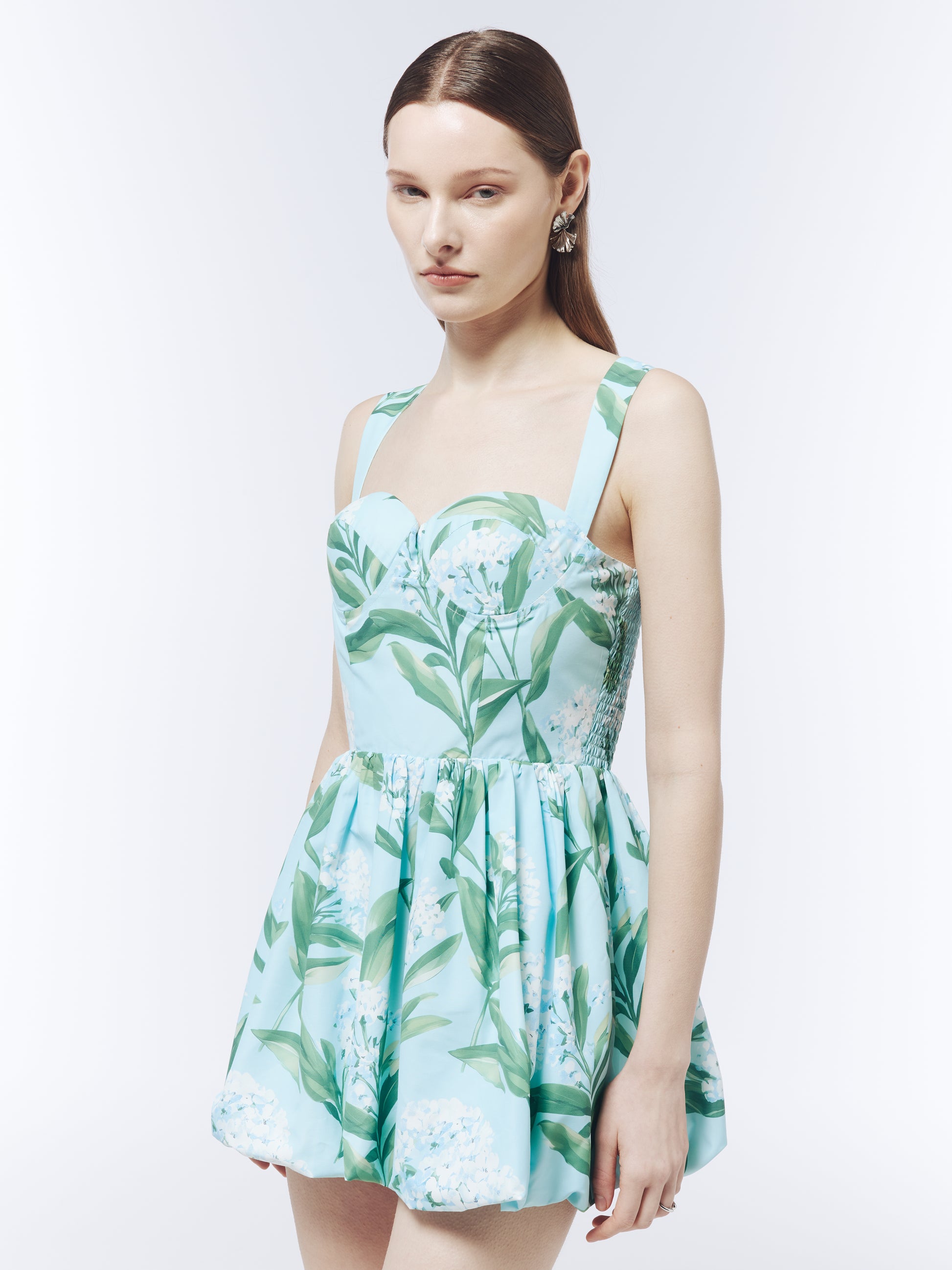 SOUR FIGS sky mist blue mini dress featuring white lilac blossoms, green leaves and a sweetheart neckline.