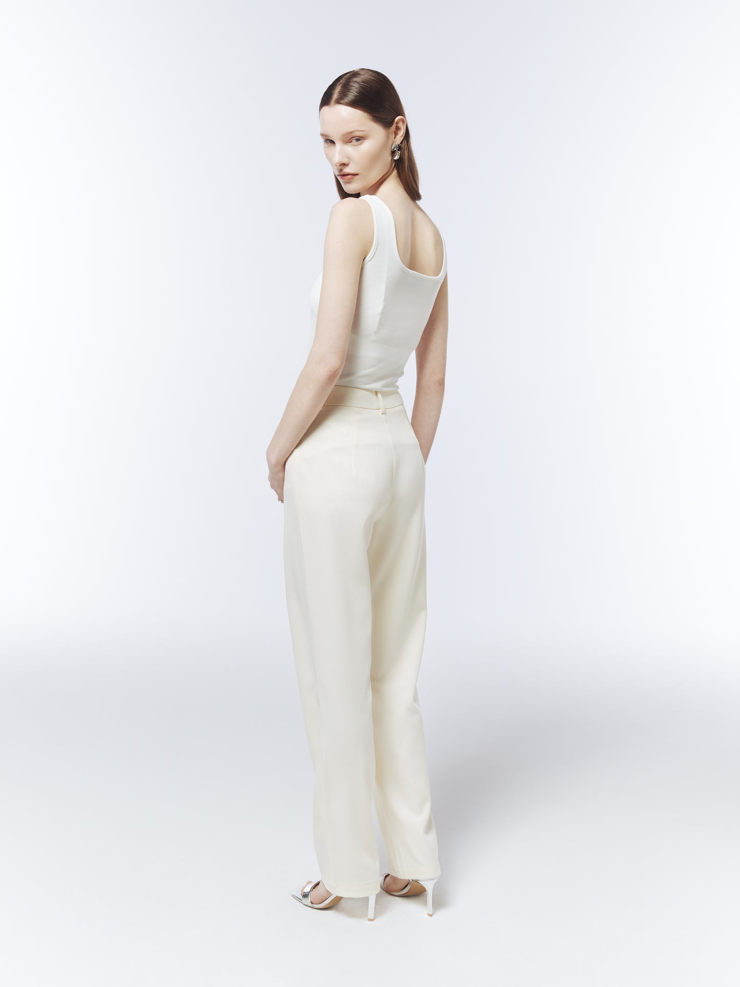 SOUR FIGS sleeveless white floral appliqué top styled with tailored ivory trousers.