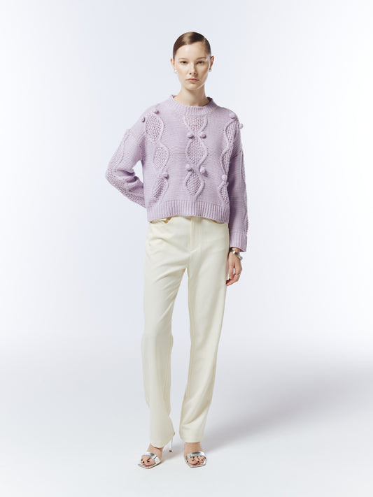 Soft lilac cable and bobble-knit jumper on model, front view showing relaxed fit and long sleeves.