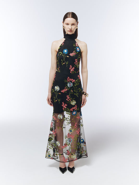 SOUR FIGS black floral-embroidered halterneck maxi dress, front model view showing the high neck and sheer skirt over a short lining.
