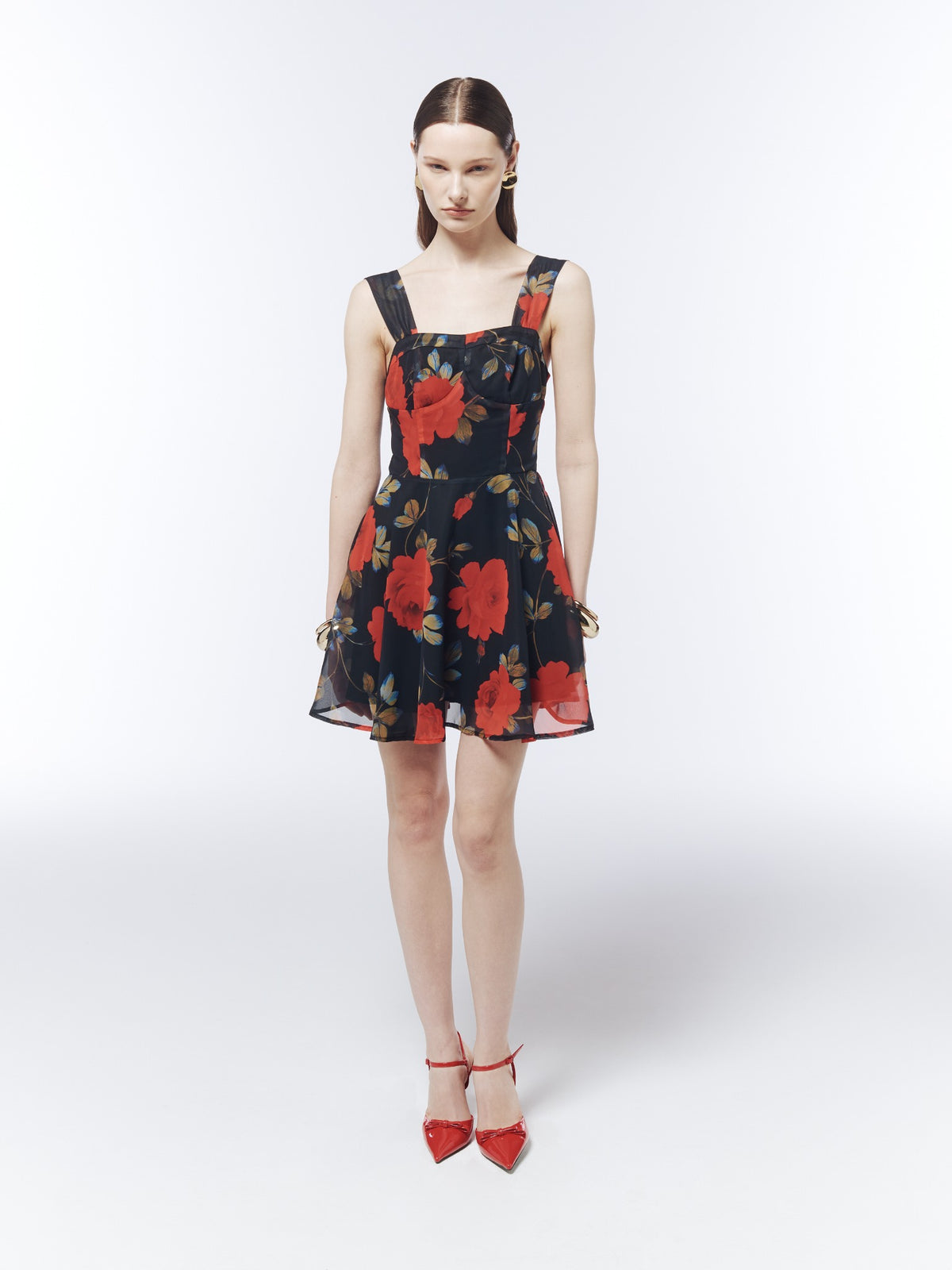 Front full-length model view of the SOUR FIGS Midnight Rose Black floral mini dress, showing the square neckline, fitted waist and flared hem.