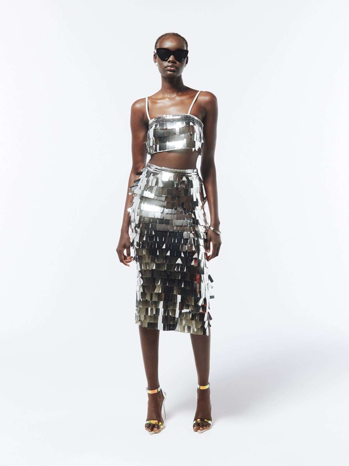 Front model view of the SOUR FIGS silver sequin co-ord set, with a strappy crop top and high-waisted midi skirt.