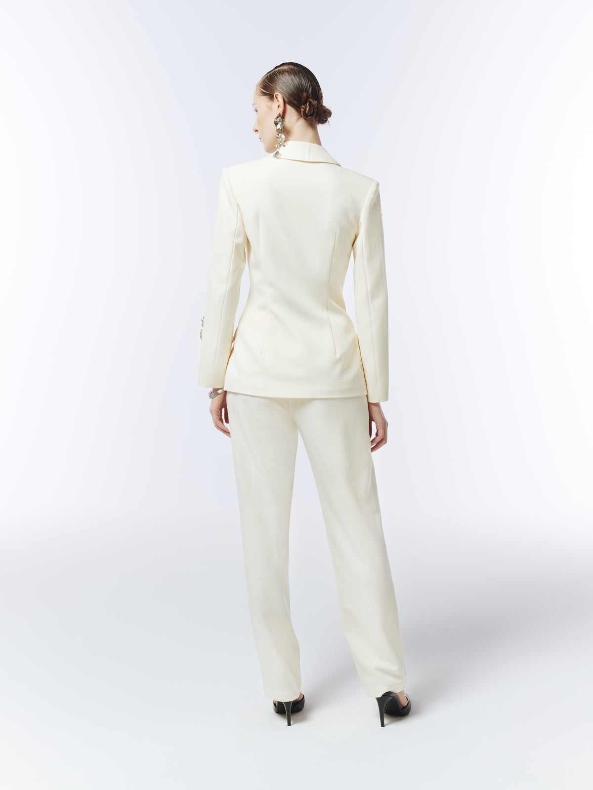 Back view of SOUR FIGS soft ivory tailored tapered trousers, styled with the matching ivory blazer.